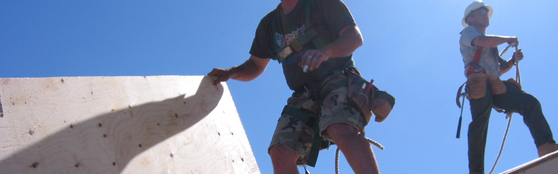 Tim Hattle of Hattle Framing Inc. working on the roof with his crew